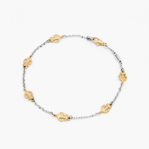 Bracelet in white gold and anchor detail in yellow gold.