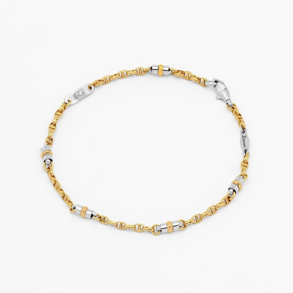 White gold bracelet and yellow gold detail.