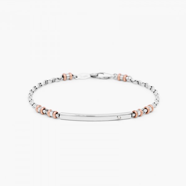 White gold bracelet with plate in the middle and white diamond.